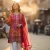 iScents blog — How to Make Perfume Last Longer in Pakistan's Heat featuring woman in traditional pink attire applying perfume
